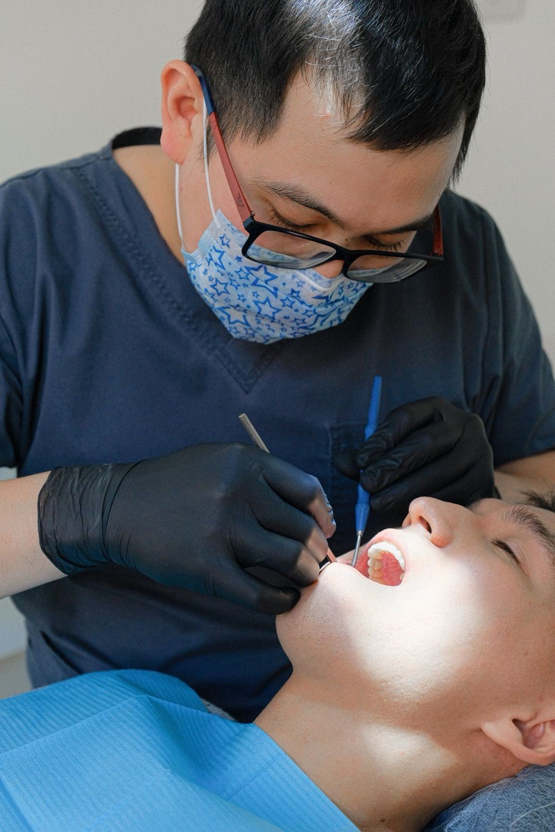 Preventive dental examination with professional tools in clinic