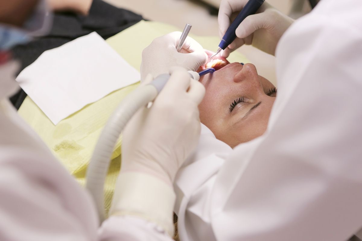 Close-up of a dentist performing a general dental treatment
